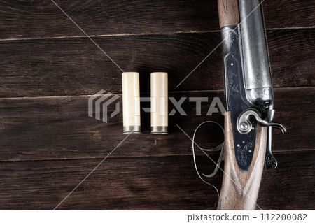 12 gauge break action smooth bored shotgun with paper cartridges. 112200082