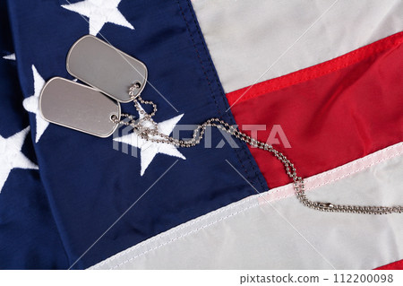 US army dog tags on USA national flag US army dog tags on USA national flag 112200098