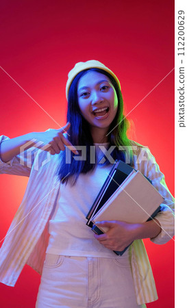 Education excitement joy woman finger textbooks 112200629