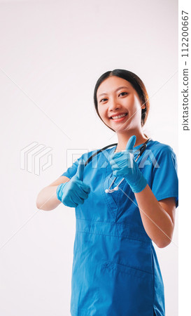 Healthcare advertising woman uniform thumbs up 112200667