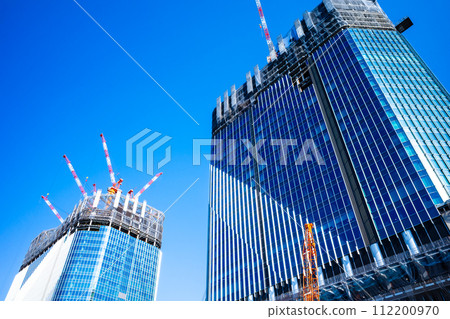 Buildings under construction and blue sky Takanawa Gateway 2024.02 b-2 High saturation contrast Buildings under construction and blue sky Takanawa Gateway 2024.02 b-2 High saturation contrast 112200970