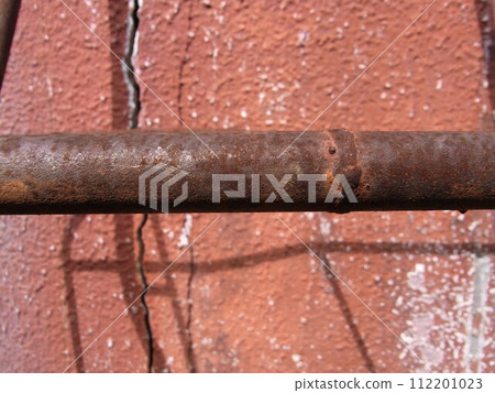 Rusty iron rod left outdoors Rusty iron rod left outdoors 112201023