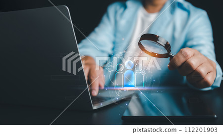 HRM, human manage, Businessman use magnifying glass to find human icon for business CRM or Customer Relation Management and customer focus target group concept, social media, Digital marketing online. HRM, human manage, Businessman use magnifying glass to find human icon for business CRM or Customer Relation Management and customer focus target group concept, social media, Digital marketing online. 112201903