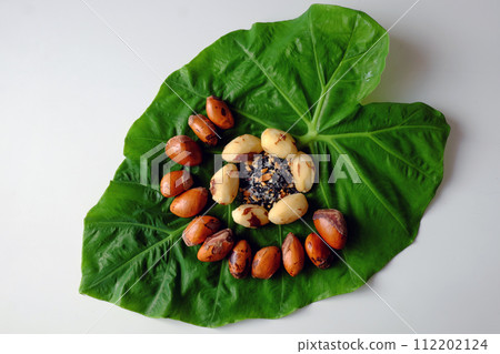 boiled durian seeds that peel ready to eat on green leaf 112202124
