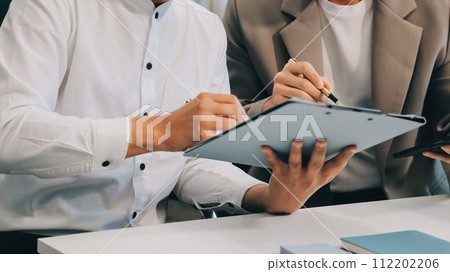 Business team working with new startup project plan and discussion information for financial strategy with laptop and digital tablet in a modern business lounge. 112202206