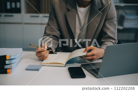 Business team working with new startup project plan and discussion information for financial strategy with laptop and digital tablet in a modern business lounge. 112202208