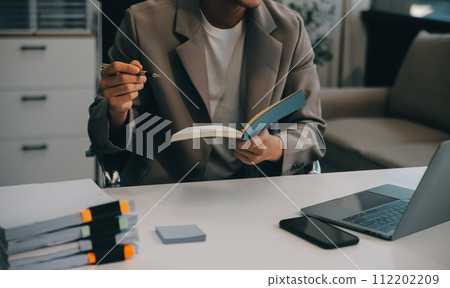 Business team working with new startup project plan and discussion information for financial strategy with laptop and digital tablet in a modern business lounge. 112202209