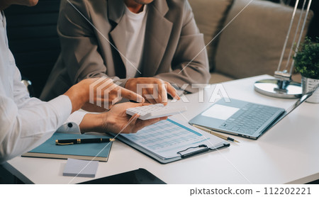 Business team working with new startup project plan and discussion information for financial strategy with laptop and digital tablet in a modern business lounge. 112202221