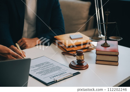 Consultation and conference of Male lawyers and professional businesswoman working and discussion having at law firm in office. Concepts of law, Judge gavel with scales of justice. 112202246
