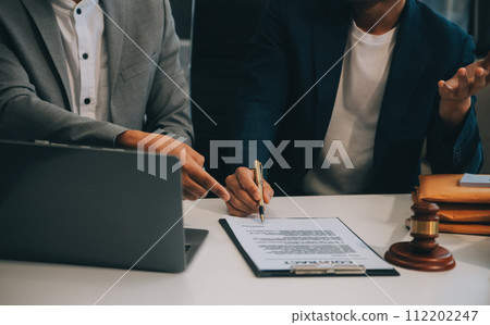 Consultation and conference of Male lawyers and professional businesswoman working and discussion having at law firm in office. Concepts of law, Judge gavel with scales of justice. 112202247