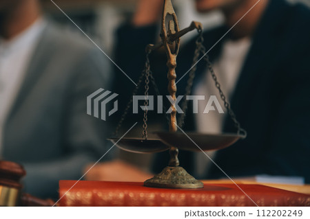 Consultation and conference of Male lawyers and professional businesswoman working and discussion having at law firm in office. Concepts of law, Judge gavel with scales of justice. 112202249