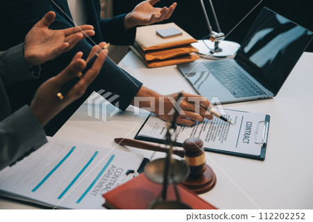 Consultation and conference of Male lawyers and professional businesswoman working and discussion having at law firm in office. Concepts of law, Judge gavel with scales of justice. 112202252
