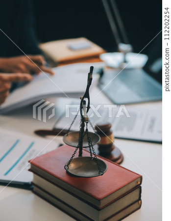 Consultation and conference of Male lawyers and professional businesswoman working and discussion having at law firm in office. Concepts of law, Judge gavel with scales of justice. 112202254