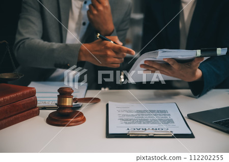 Consultation and conference of Male lawyers and professional businesswoman working and discussion having at law firm in office. Concepts of law, Judge gavel with scales of justice. Consultation and conference of Male lawyers and professional businesswoman working and discussion having at law firm in office. Concepts of law, Judge gavel with scales of justice. 112202255