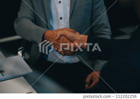 Consultation and conference of Male lawyers and professional businesswoman working and discussion having at law firm in office. Concepts of law, Judge gavel with scales of justice. Consultation and conference of Male lawyers and professional businesswoman working and discussion having at law firm in office. Concepts of law, Judge gavel with scales of justice. 112202256