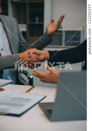 Consultation and conference of Male lawyers and professional businesswoman working and discussion having at law firm in office. Concepts of law, Judge gavel with scales of justice. Consultation and conference of Male lawyers and professional businesswoman working and discussion having at law firm in office. Concepts of law, Judge gavel with scales of justice. 112202257