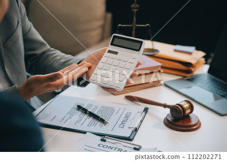 Consultation and conference of Male lawyers and professional businesswoman working and discussion having at law firm in office. Concepts of law, Judge gavel with scales of justice. 112202271