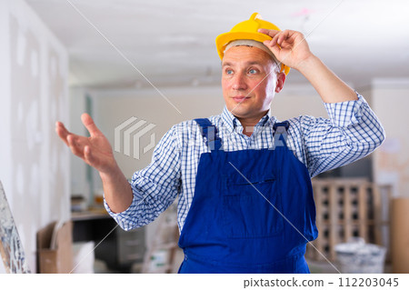 Portrait of surprised man builder 112203045