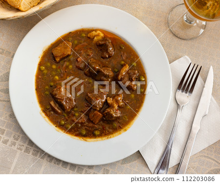 Stewed beef with vegetables (Ternera la Jardinera) - this is Spanish traditional meat dish 112203086