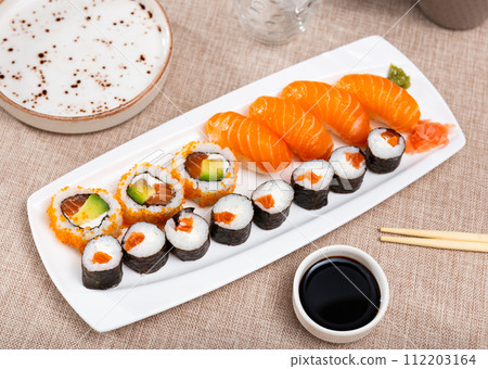 On table there portion set with maki - uramaki and nigiri 112203164