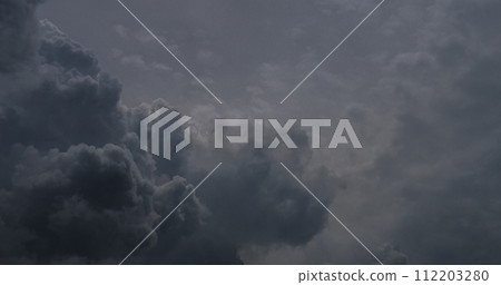 Dramatic dark storm thundercloud rain clouds on black sky background. Dark thunderstorm clouds rainny landscape. Meteorology danger windstorm disaster climate. Dark cloudscape storm disaster gray sky 112203280