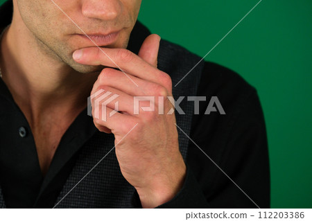 Businessman looking to the side in contemplation. Businessman looking to the side in contemplation. 112203386