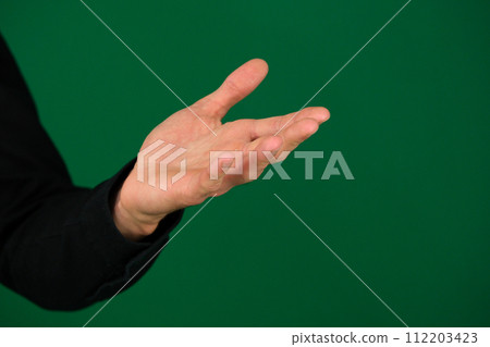 Hand men isolated on green background Hand men isolated on green background 112203423