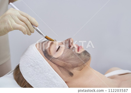A beauty spa offers laser facial treatment. Woman undergoes a rejuvenating peel A beauty spa offers laser facial treatment. Woman undergoes a rejuvenating peel 112203587