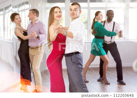 Man and woman dancing waltz in couple during lesson at studio Man and woman dancing waltz in couple during lesson at studio 112203648