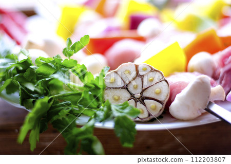 Raw meat skewers with vegetables on wooden background 112203807