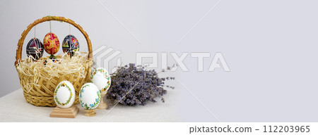 postcard baner calendar empty space holiday easter eggs embroidery ribbons on eggshell krashanka Easter wicker basket with pastel eggs for Happy holiday and celebration Banner. Greeting card. 112203965