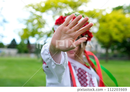 No war stop girl raised hand extended palm Stop Ukrainian woman national shirt against backdrop of garden of trees stops tanks Russian attack Victory of Ukraine Help Ukraine Glory Ukraine Heroes Glory No war stop girl raised hand extended palm Stop Ukrainian woman national shirt against backdrop of garden of trees stops tanks Russian attack Victory of Ukraine Help Ukraine Glory Ukraine Heroes Glory 112203989