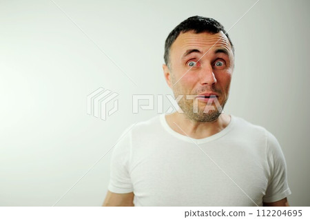 Portrait of man surprised face expression Surprised male hipster, keeps mouth opened, being stupefied as advertises something, Omg concept shouting WOW, with copy space fot your text. Shock content Portrait of man surprised face expression Surprised male hipster, keeps mouth opened, being stupefied as advertises something, Omg concept shouting WOW, with copy space fot your text. Shock content 112204695