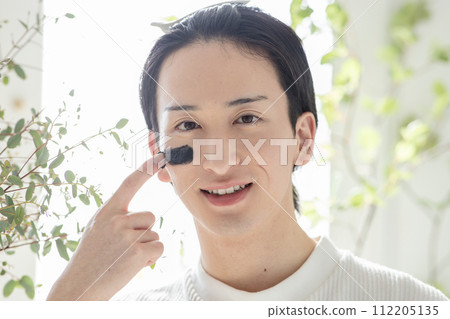 A refreshing man doing skin care A refreshing man doing skin care 112205135
