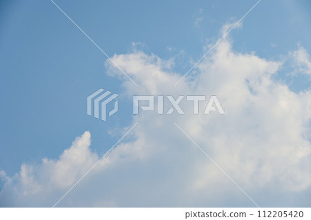 beautiful blue sky and white fluffy cloud with sunrise in the morning, natural background 112205420