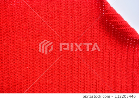 red wool knitted yarn texture, woolen fabric on white background red wool knitted yarn texture, woolen fabric on white background 112205446