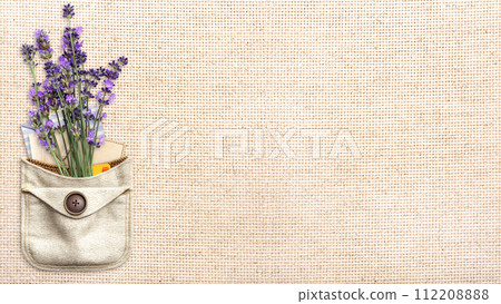 Purple lavender flower and retro envelopes in pocket. Bunch of fresh lavandula flowers in pouch on canvas texture backdrop. Horizontal eco background with natural linen texture. Copy space for text Purple lavender flower and retro envelopes in pocket. Bunch of fresh lavandula flowers in pouch on canvas texture backdrop. Horizontal eco background with natural linen texture. Copy space for text 112208888
