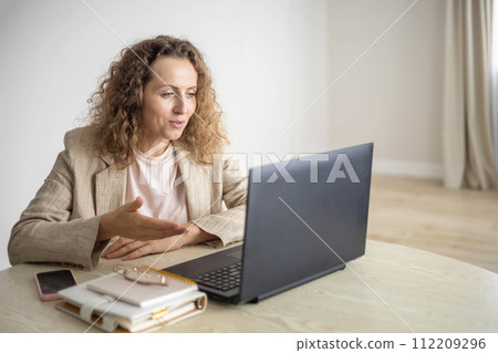 Modern business woman working online use laptop making notes e learning distance education at home 112209296