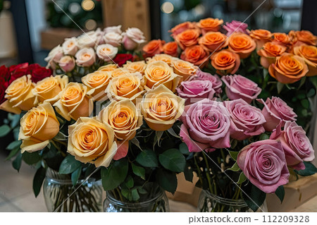 Multicolored roses in a flower shop - fresh supply of cut flowers for spring holidays, floral shop. AI generated 112209328