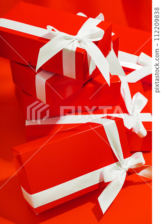 Red gifts on a yellow background 112209838