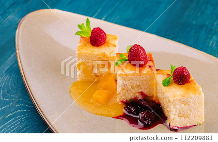 Piece of cottage cheese casserole with cherry jam Piece of cottage cheese casserole with cherry jam 112209881