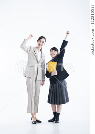 Teacher and student, white background, looking at camera, fist pump 112210555