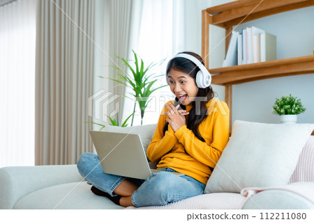 Young happy lucky woman student feeling excited winning Young happy lucky woman student feeling excited winning 112211080