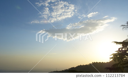 A vast landscape with clear skies, clouds, and snowy mountains. A vast landscape with clear skies, clouds, and snowy mountains. 112213784