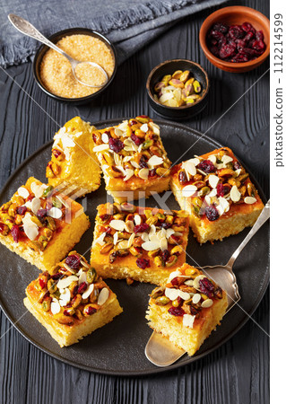 slices of yogurt cake with nuts and dried berries 112214599