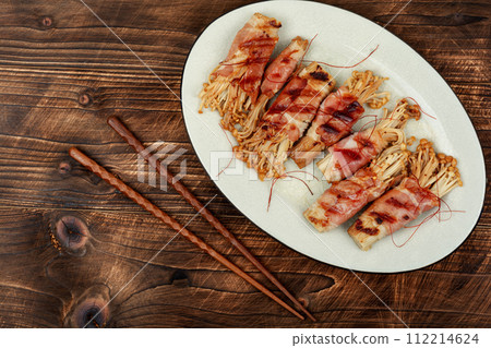 Enoki mushroom roll appetizer fried in bacon Enoki mushroom roll appetizer fried in bacon 112214624