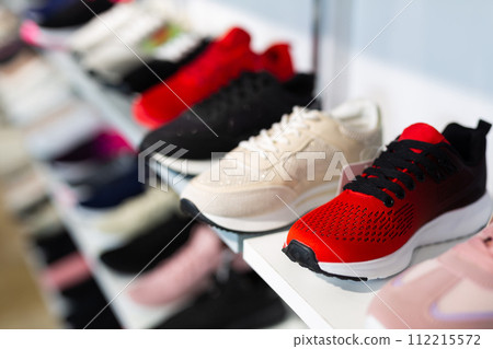 Counter with sports shoes in a store Counter with sports shoes in a store 112215572