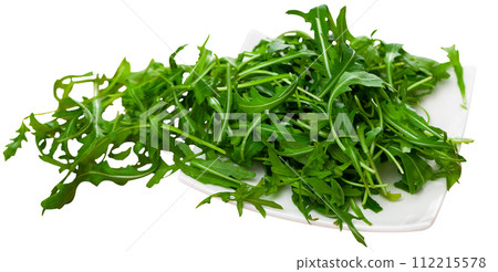 Ceramic plate with pile of fresh arugula leaves Ceramic plate with pile of fresh arugula leaves 112215578