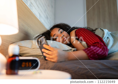 Woman can't fall asleep, insomnia a sleep problems. Concept of sleep routine and techniques for better sleep. World Sleep Day. Woman can't fall asleep, insomnia a sleep problems. Concept of sleep routine and techniques for better sleep. World Sleep Day. 112215649