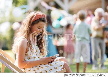 Beautiful birthday girl received birthday text message, text messaging back. 112215857